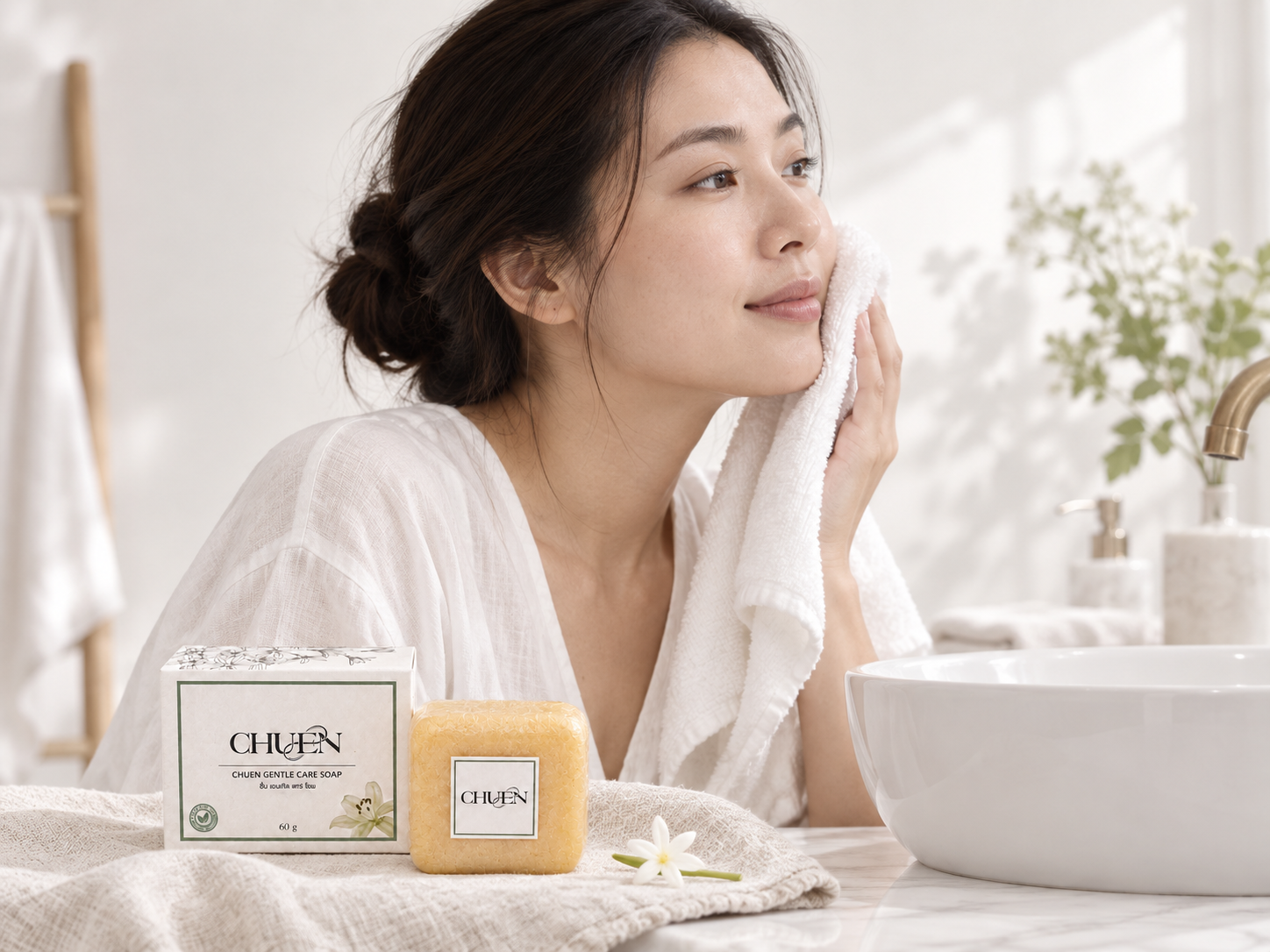 Gently patting the face dry beside a washbasin